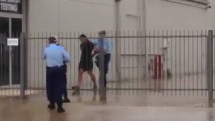 Nabbed: Luke Robin being arrested by police at a North Albury business on January 3, just after 3pm.