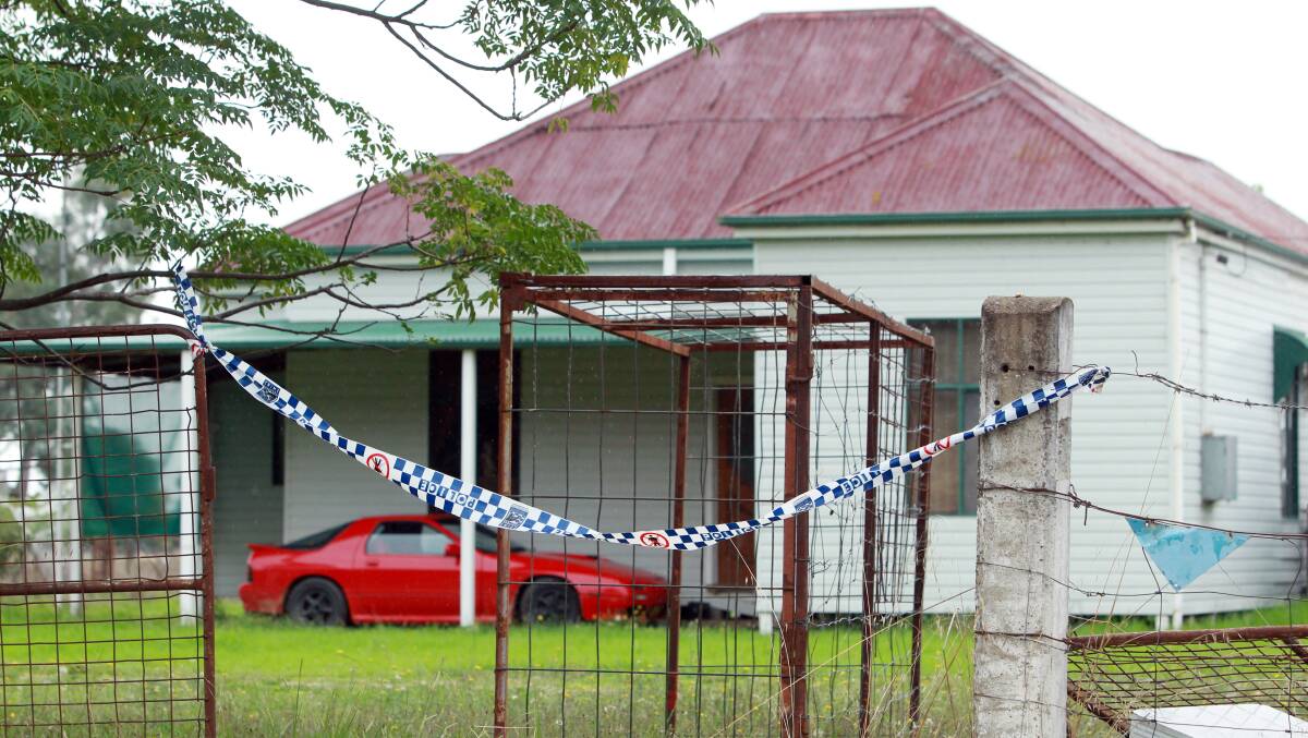 The scene at George Wetmore's home near Holbrook the day after his son was run over in the driveway on April 8, 2014. Troy Wetmore's Mazda RX7 can be seen under a carport at the front. Anthony Craig Cromb is accused of the younger man's manslaughter.