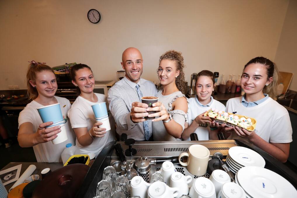 CAFE COLLECTION: Wodonga Middle Years College assistant principal Steven Fouracre and his dance teacher Paula Thompson, with students Sharni Barton, Jenna Barton, Zara Johnston and Scarlet Rhook (all 14). Picture: JAMES WILTSHIRE