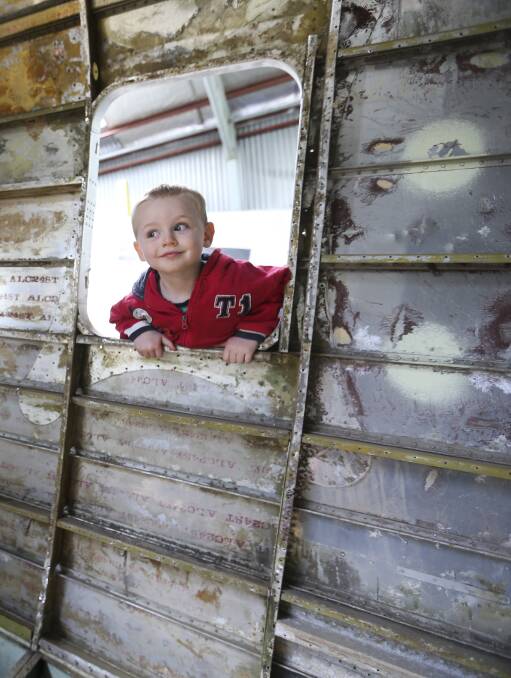SEE WHAT'S GOING ON: Stuart Tate, 3, of Lavington, checks out the progress at Saturday's Uiver DC-2 restoration open day in Albury. Picture: ELENOR TEDENBORG
