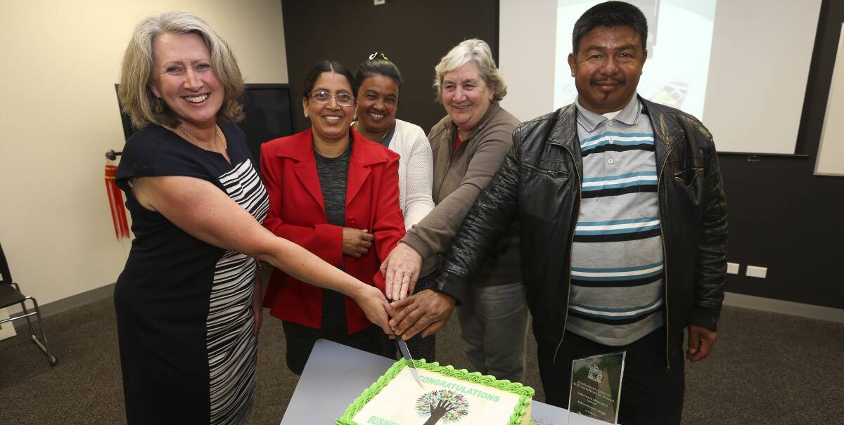 CELEBRATE SUCCESS: Gateway Health acting chief executive Vicki Pitcher, Bhakti Dhamala, Purna Chhetri, Lynn Bell and Phadam Magar mark the agency's award from the Victorian Multicultural Commission. Picture: ELENOR TEDENBORG