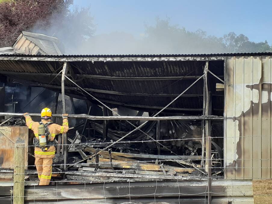 MOPPING UP: Little could be done to save this Osbornes Flat shed, which was well alight when emergency services arrived, but firefighters prevented Monday morning's blaze from spreading further. Picture: COUNTRY FIRE AUTHORITY