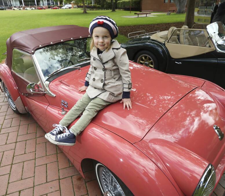 A TRIUMPHANT RIDE: Albury's Charlotte Townsend, 4, sees what a Triumph sports car has to offer at the TR Register Australia display in QEII Square, part of the club's yearly catch-up and competition. Picture: ELENOR TEDENBORG