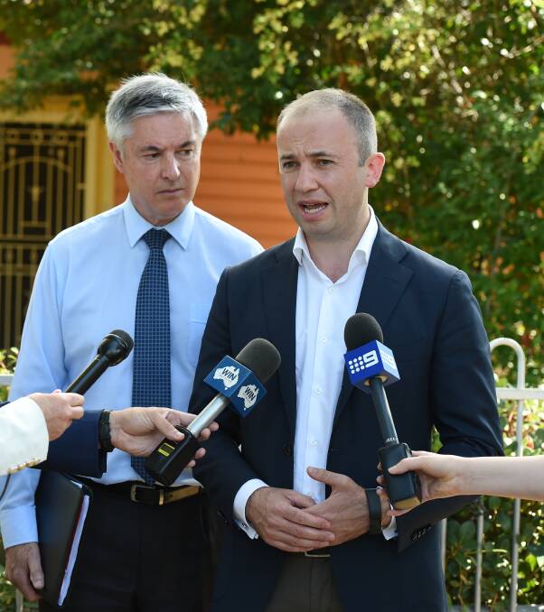 ON SITE: Member for Albury Greg Aplin listens as NSW Minister for Innovation and Better Regulation Matt Kean talks to the media on Monday. Picture: MARK JESSER