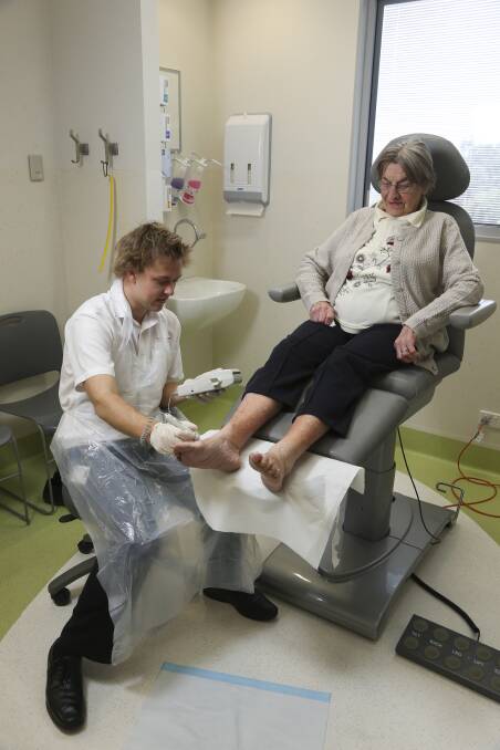 FOOT CARE: Charles Sturt University student Jordan Crawford provides Joyce Lieschke with some clinical and preventative advice on Tuesday. Picture: ELENOR TEDENBORG