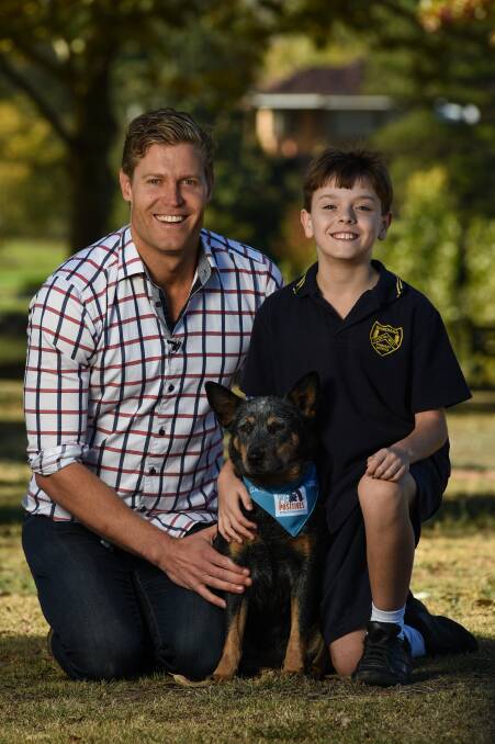 Dr Chris Brown and canine scientist Mia Cobb talk to Bandiana Primary School students about responsible pet ownership in Wodonga on Tuesday. Pictures: MARK JESSER