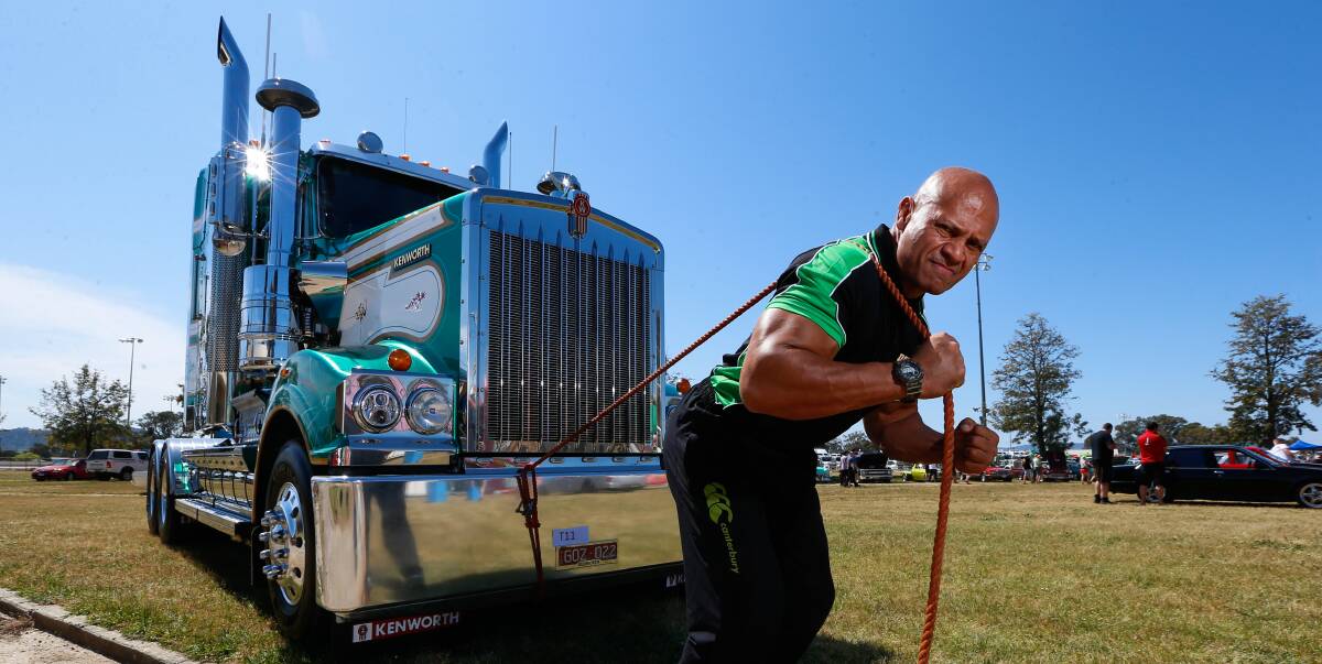 STRENGTH TEST: Derek Boyer, who grew up in Albury, demonstrates his truck-pulling at Sunday's Convoy for Kids. He was undefeated in Australia's strongest man competitions from 1997 to his retirement in 2012. Picture: MARK JESSER