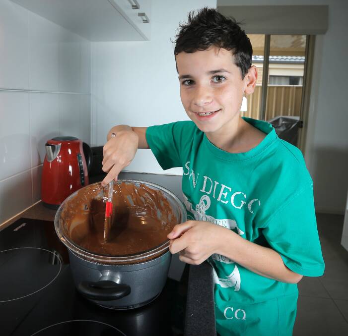 FLASHBACK: Wodonga's Jye McBurnie, then 13, melts chocolate for his Mars Bar rocky road in September 2014. "Nan got it out of a magazine, she loves making it. I have a go every now and then; it's not as good as hers," he says.