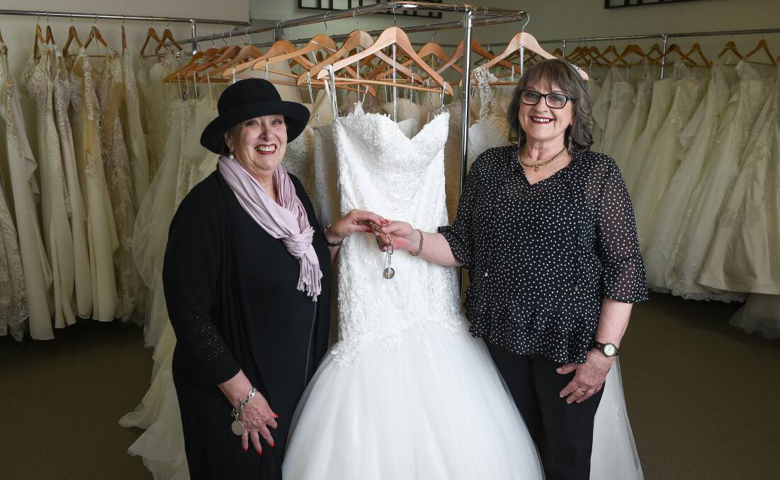 CHANGING OF THE GUARD: Former owner Gloria Mahony says the incoming leader of Jack and Jill Bridal, Border dressmaker Sandra Stewart, has the right passion and interest to suit her new position. Picture: MARK JESSER
