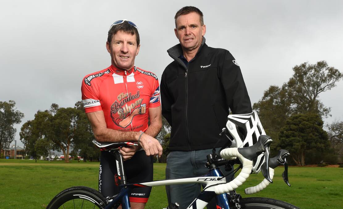 DETERMINED: Ken Payne and Greg Featonby plan to make sure the iconic Wagga to Albury road race named after their friend continues to run. Picture: MARK JESSER