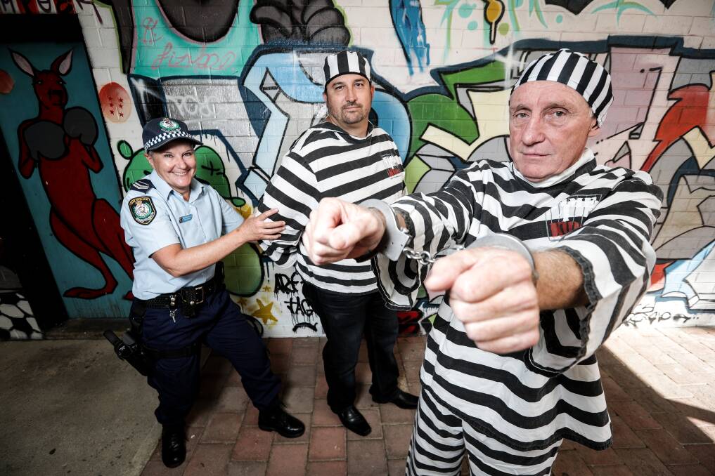 THE JIG IS UP: Senior Constable Belinda Wells looks pleased to capture Rad Sredojevic, of Pixel Accountants, and PRD Real Estate's Graham Chapman. Picture: JAMES WILTSHIRE