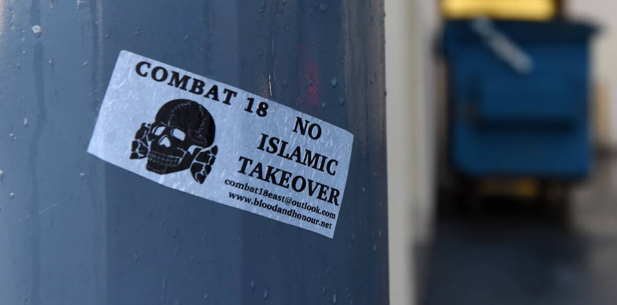 ON THE STREETS: The stickers, which refer to neo-Nazi organisations, could be seen on poles in Griffith Road, Lavington. Picture: MARK JESSER
