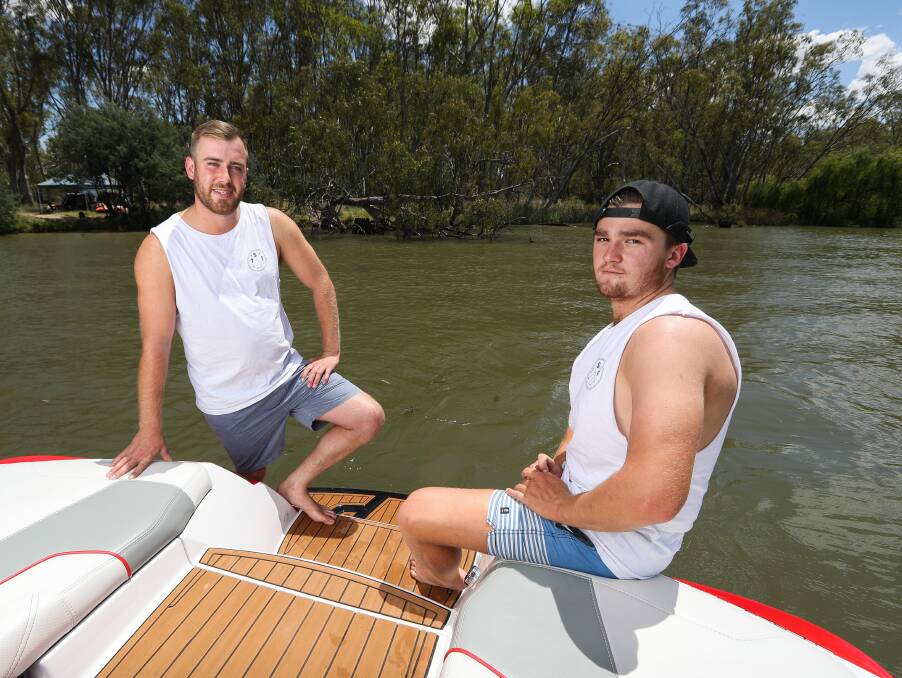 NOT IMPRESSED: Longtime visitors James Parsonson, of Prahran, and Pakenham's Sam Werner feel there's got to be a better way to tackle Murray River erosion than banning the high wash water sports they love. Picture: MARK JESSER