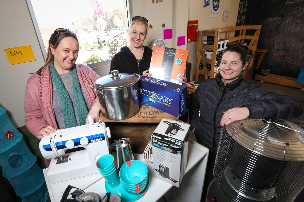 COLLECTING THINGS: Volunteer Kylie Watson and Library of Things co-founders Claire Greenhalgh and Corrie Pierce. Picture: JAMES WILTSHIRE