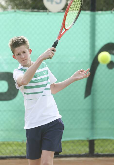 EYE ON THE BALL:  Wodonga's Ryan Hooper, 14, follows through his shot at the weekend tennis clinic attended by three greats of the game. Pictures: ELENOR TEDENBORG