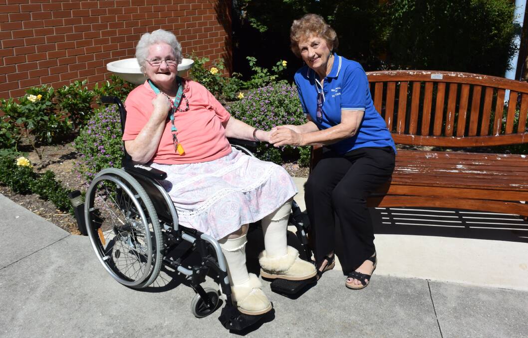 A HELPING HAND:  Mercy Place Albury resident Thelma Fergusson often receives a hand massage from volunteer Dawn Prentice, of Lavington.
