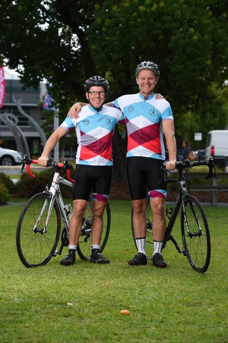Wodonga's Marty Cross and Dan Owen prepare for the 7 Peaks 7 Days Cycle Challenge. Pictures: MARK JESSER