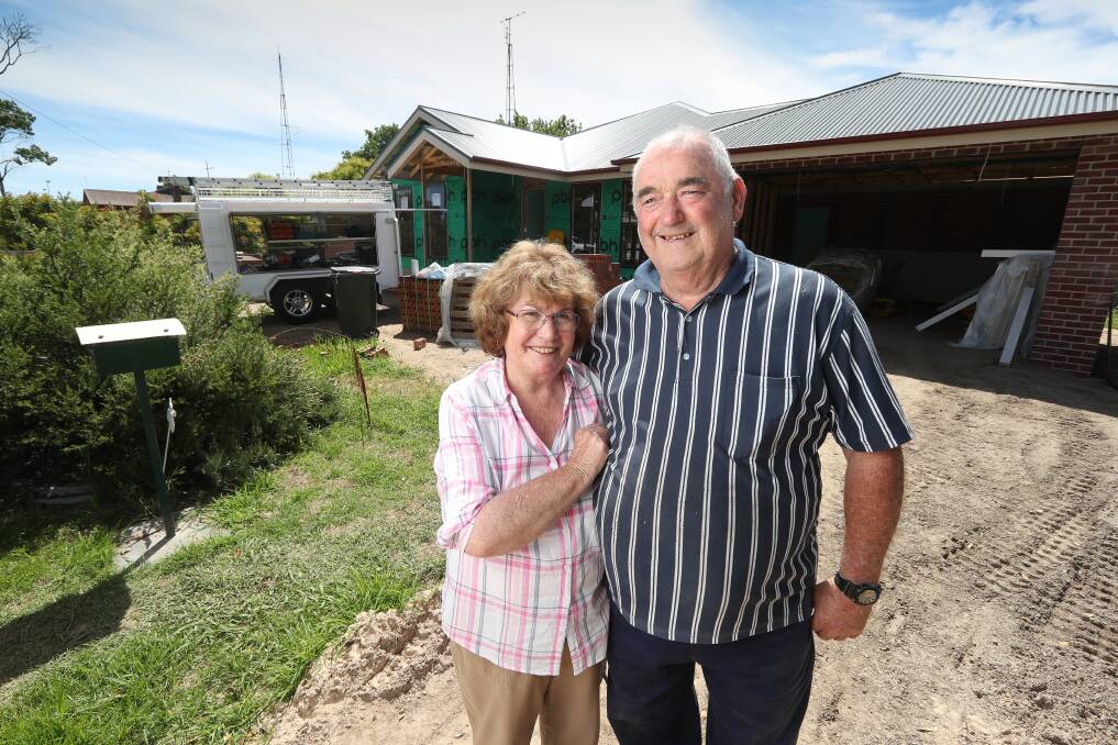 TAKING SHAPE: Marilyn and Jeffrey McPherson hadn't expected to rebuild after 51 years in their Holbrook home, but a positive loose-fill asbestos test changed that. Now, their new house is progressing quickly. Picture: MARK JESSER