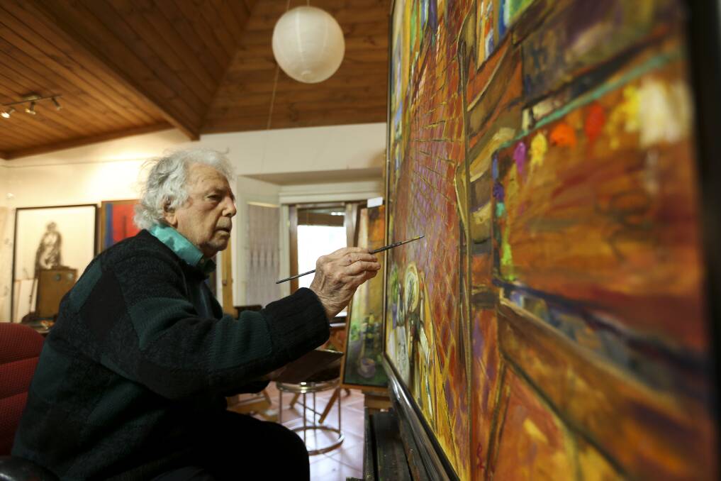 AT WORK Painter Brian Seidel prepares for his Beechworth exhibtion. Originally from South Australia, the artist has lived in the North East in later years. Picture: ELENOR TEDENBORG