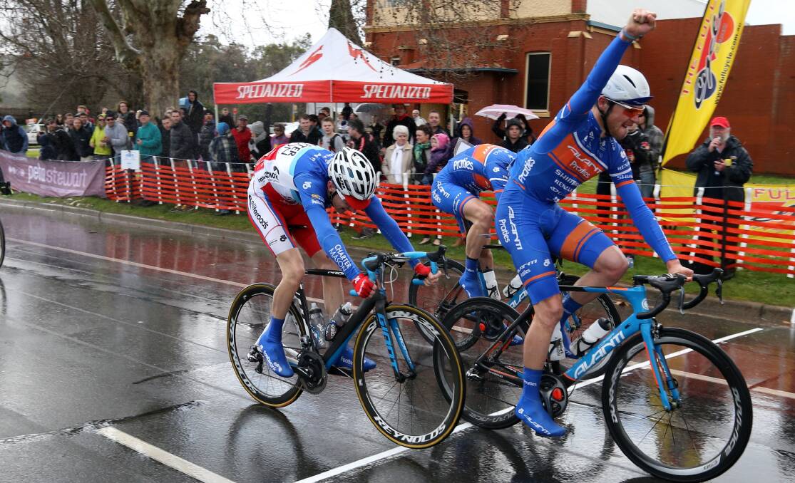 MOMENT OF TRIUMPH: Wollongong's Scott Law crosses the line to win last year's memorial race from Bendigo rider Sam Crome and Mount Beauty's Neil van der Ploeg.