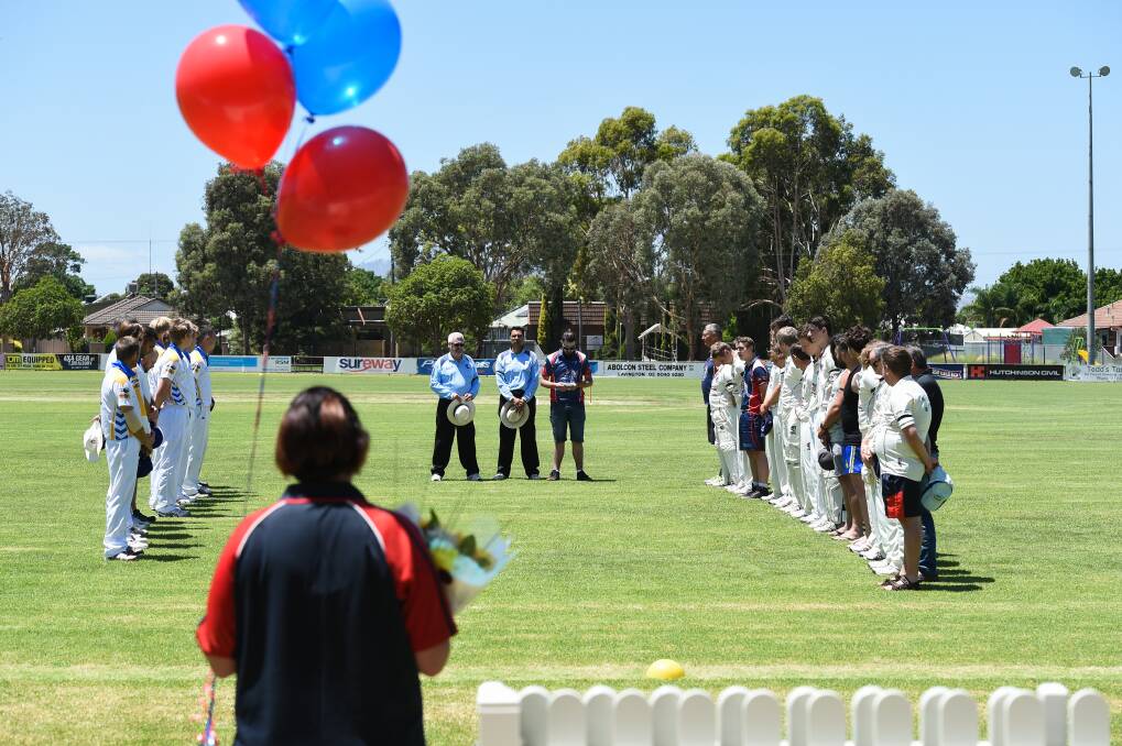 SHARED SILENCE: Players and umpires pay tribute to the Wodonga youngster. Picture: MARK JESSER 