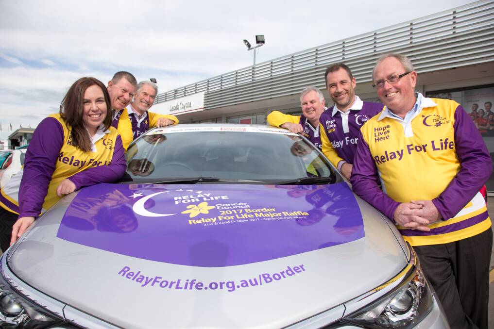 RELAY READY: Border Relay For Life co-chairperson Kate Wilkinson, Commercial Club Albury's Jeff Duck, Neville Jacob, of Jacob Toyota, Tint A Car's Rod Stratton, Jacob Toyota's Dean Jacob, and co-chairperson Pete Whitmarsh unveil the major raffle. Picture: SIMON BAYLISS