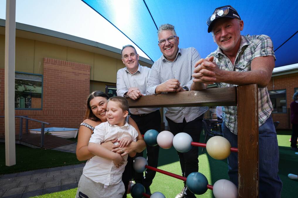 Wodonga mum Shana Wallace and her son Chase, 5, value the help made possible through the financial support of SS&A Club Albury and the Phegan family. And SS&A chief executive Gerard Darmody, Albury Wodonga Regional Cancer Centre Trust Fund manager Tom O'Connor and Danny Phegan equally value seeing Chase play happily. Picture by James Wiltshire