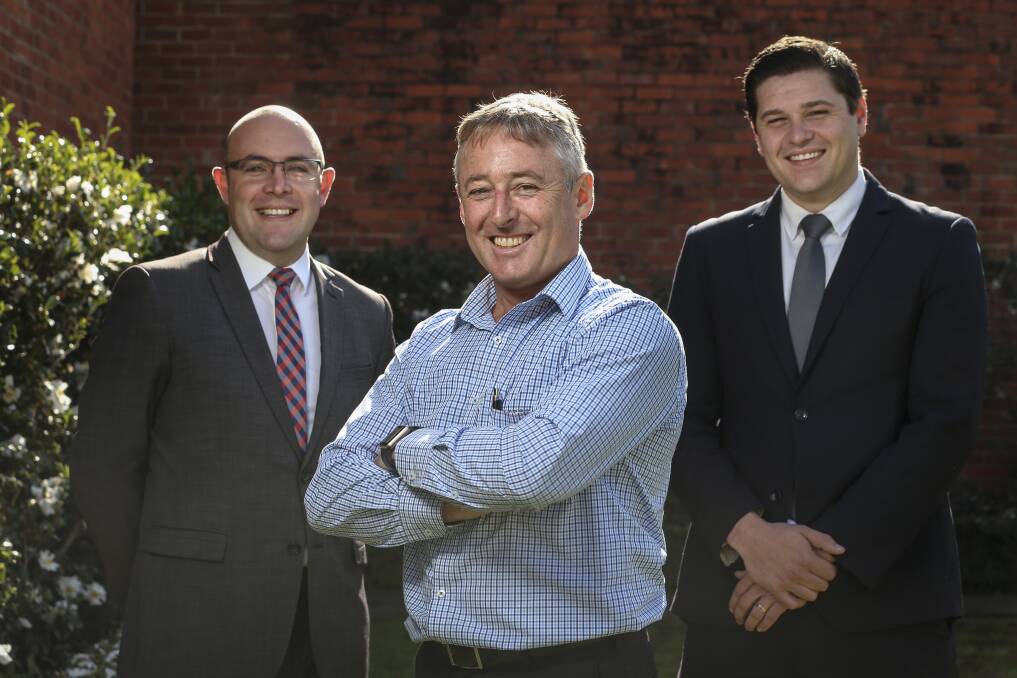 INDUSTRY ADVANCES: Real Estate Institute of NSW Albury divisional chairman Greg Wood (centre), pictured with Clark Watson and Brent Booker, says agents need a proper grounding in property.