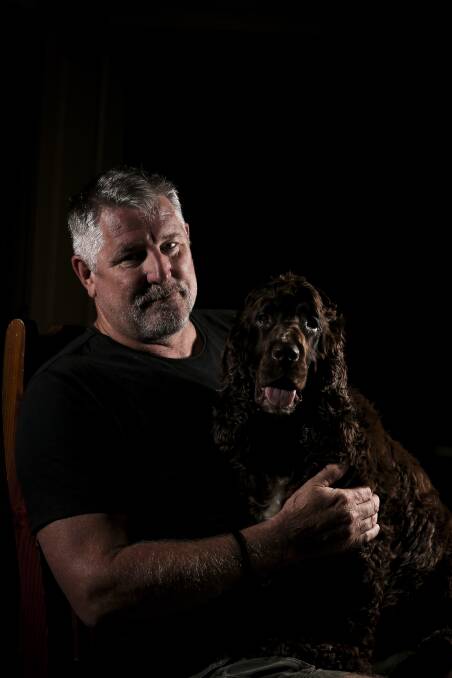 CREATURE COMFORT: Baranduda veteran Dennis Ramsay with the family's cocker spaniel Koden. "He's not a carer dog, but he's a beautiful dog," Mr Ramsay says. "You need an animal in your life." Picture: JAMES WILTSHIRE