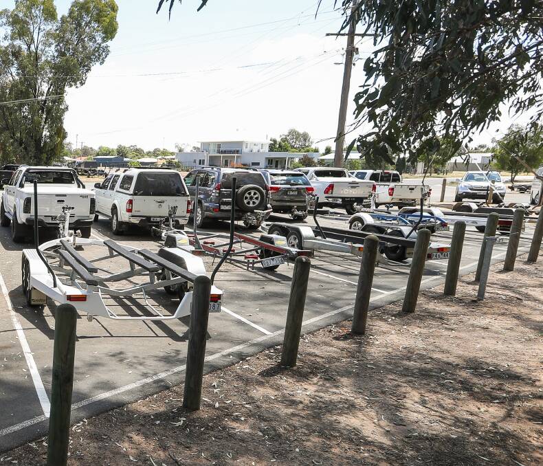 PEAK SEASON: The car park next to Bundalong's Pasley Street boat ramp, full of vehicles and trailers, shows the popularity of boating in this section of the Murray River. Picture: MARK JESSER