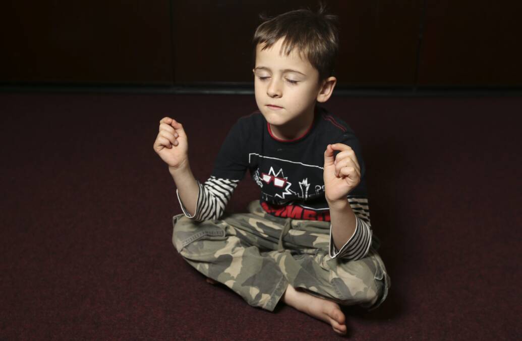 A CONTEMPLATIVE APPROACH: Glenroy youngster Zeke Halford, 7, focuses on his breathing in the introduction to yoga, part of the spring school holiday activities program.