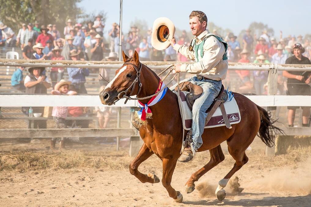 TWO-TIME CHAMPION: Tooma's John Mitchell celebrates back-to-back challenge titles at last year's The Man From Snowy River Bush Festival. This year, a rodeo invitational in Wodonga has been scheduled against the festival.
