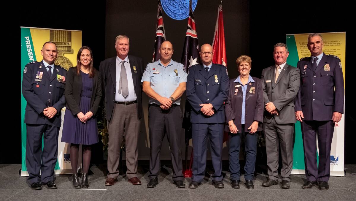 WODONGA WEST WINNERS: Pictured are CFA chief officer Joe Buffone, Northern VIctoria MLC Jaclyn Symes, medal recipients David Jewell, Matthew Dobson and Graham Mathey, district 24 support officer Julie Reeves, CFA board member and Wodonga West captain Ross Coyle and district 24 operations manager Paul King.