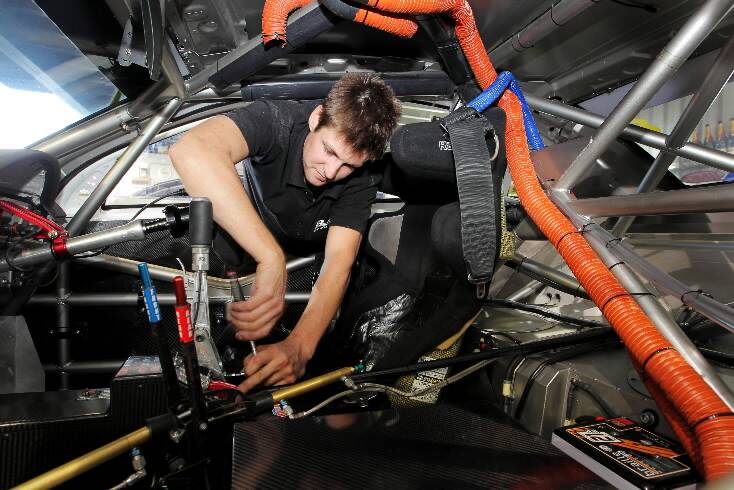 Head mechanic Chris Rissman works on the Jason Bright BOC car.