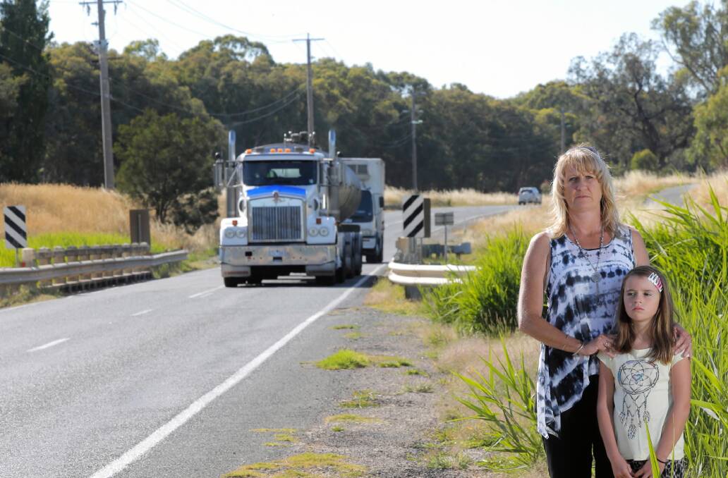 Vanessa Harding, with her daughter Olive, 8, is concerned the Middle Creek bridge on the Kiewa Valley Highway is an accident waiting to happen. Picture: TARA GOONAN