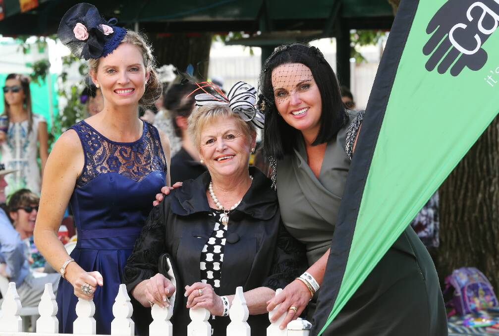 Carla McFaull, Di Mant and Jodie Tiernan enjoy the hospitality at the Care Van Marquee in Albury yesterday. The day raised about $3000 for the charity. 