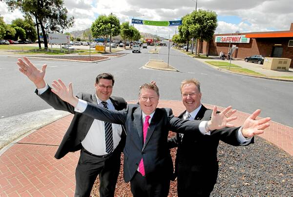 THE ROAD THAT WAS: Bill Tilley, Denis Napthine and Wodonga mayor Mark Byatt celebrate the announcement that this section of Elgin Boulevard will soon be no more. Picture: DAVID THORPE