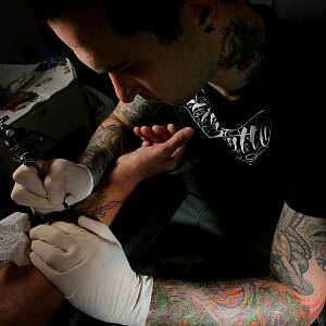 Tattooist Ben Morris from Twin City Tattoo works on an arm. PICTURE: David Thorpe.