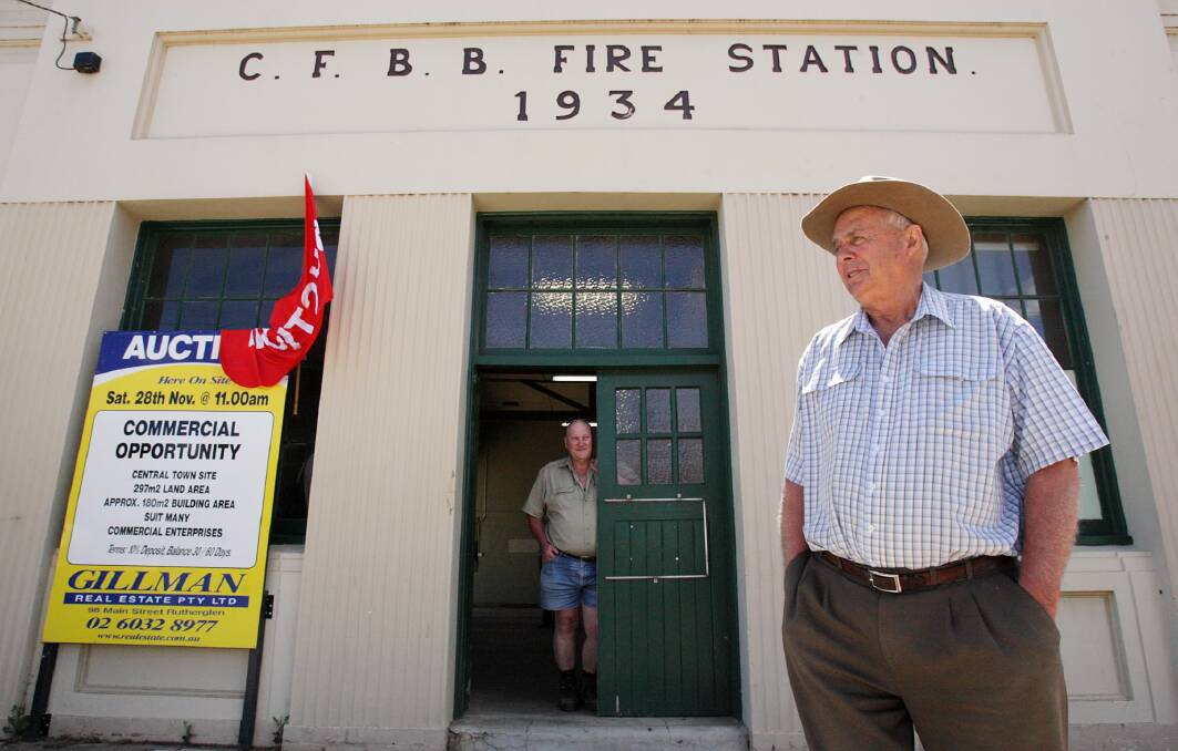 Ken Buscall, foreground, with First Lieutenant Milton Thompson at the town’s former fire station.