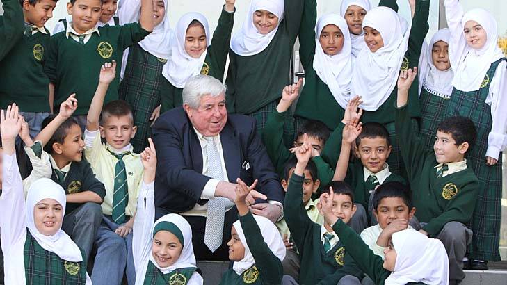 Guiding principal: Dr Ray Barrett with some of the pupils at Malek Fahd in Greenacre. Photo: Peter Rae