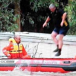 Paul McLeod leaps into the rescue boat. Picture: PRIME7 NEWS