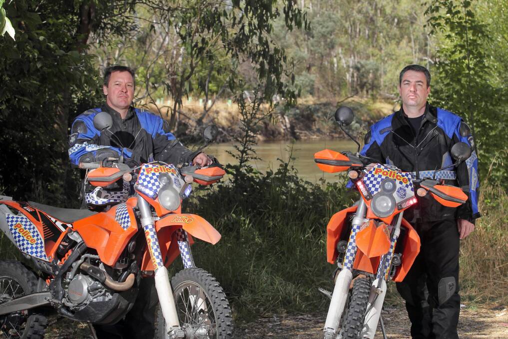 Leading Sen-Constable Stuart Jones and Acting-Sgt Brad Hall out on patrol near Wodonga yesterday. Picture: BEN EYLES