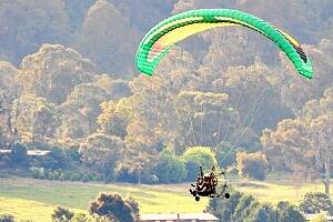 A paraglider near Mount Bogong on Saturday, the same day a man hit communication lines and sustained serious injuries. The injured pilot was taken to a Melbourne hospital. Picture: GREG SUJECKI
