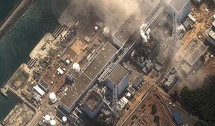 Blowing off ... fire erupts from the stricken nuclear plant at Fukushima, 250 kilometres north of Toyko.