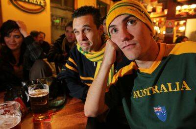 Chantelle Mather, 19, from Wodonga, Bruce Hill, 27, from Wodonga and Brendon Llewelyn, 24, from Wodonga, grimace at the Socceroos' humiliating loss to Germany at Paddy's in Albury. Picture: KYLIE GOLDSMITH