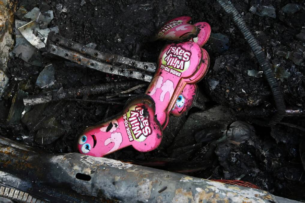 A novelty party game was the only thing that survived the car fire. Pictures: MATTHEW SMITHWICK
