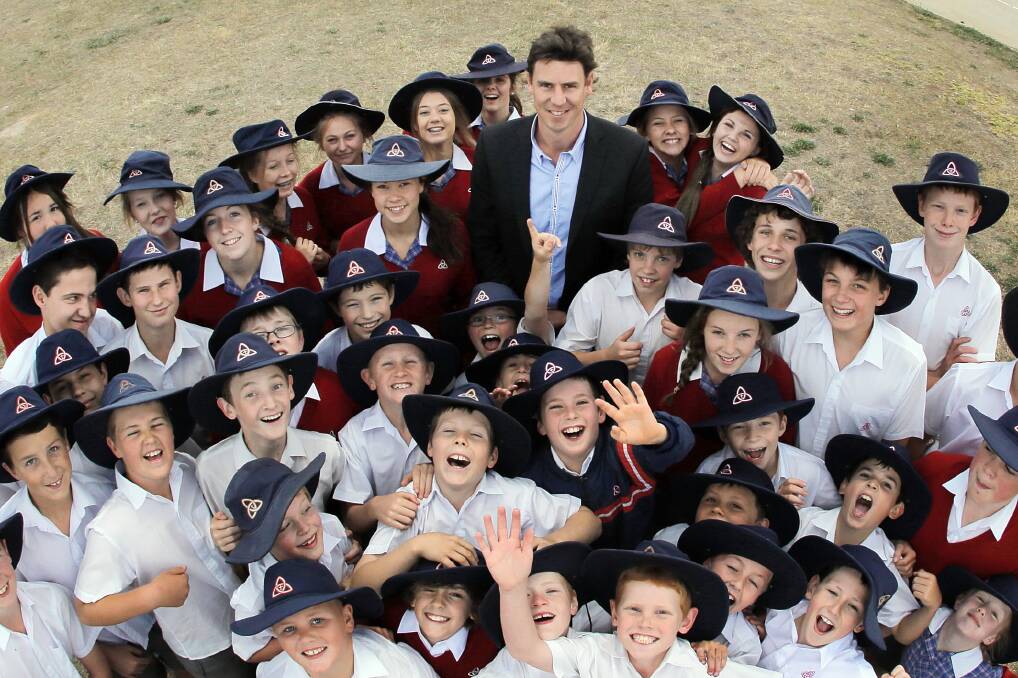 King of the kids ... Justin Koschitzke was a popular visitor at Trinity Anglican College’s senior school speech day. Picture: TARA GOONAN