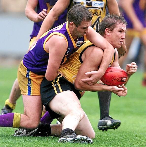 Thompson is tackled by Brendan Hehir playing for the Ovens and Murray league in 2003.