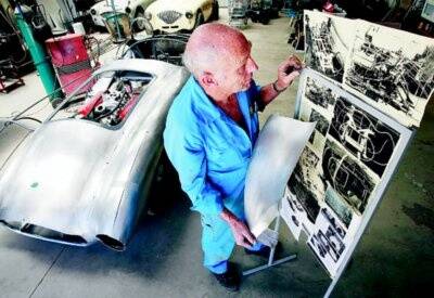 Panel beater Terry Cornelius pictured last December during early work on completing the rare sports car using just photographs to guide him.