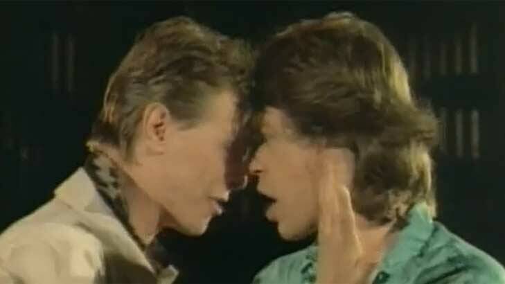 David Bowie and Mick Jagger get up close and personal in their 1985 video for <i>Dancing in the Street</i>.